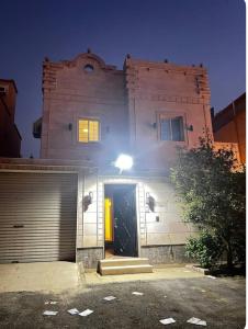 a building with a door and a garage at hostel in Obhur in Jeddah