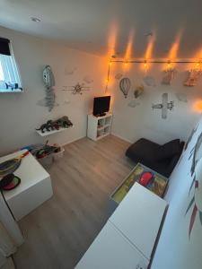 a living room with a couch and a tv at Kanalhuset in Tvååker