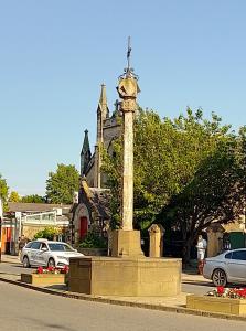 a clock tower in the middle of a street at Turret View - spacious central location in Peebles +33 photos