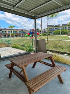 a picnic table with a laptop sitting on top of it at TBSC by Reemon in Keningau