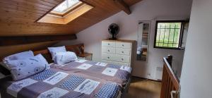 a bedroom with a bed with pillows and a window at Park Village Océlandes in Saint-Julien-en-Born +63 photos