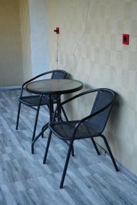 two chairs and a table in a room at Hotel Lemi in Mestia +43 photos