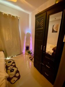 a room with a room with a bed and a door at Casa Hiraya - Shore 2 Tower 2 in Manila