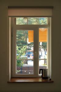 a window in a kitchen with a view of a street at Hotel Lemi in Mestia