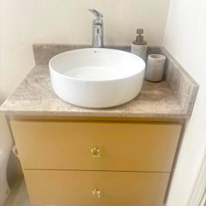 a white sink on a counter in a bathroom at Cazuria - by ZenBreak in Saint George