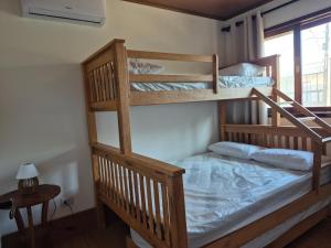 a couple of bunk beds in a room at Privê Monte Serrat, Chalé 18 in Gravatá +28 photos