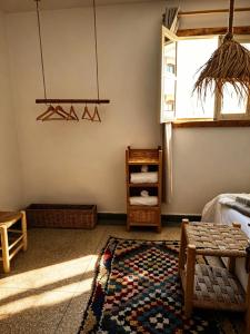 a living room with a rug and a window at Grip Sea Morocco in Agadir