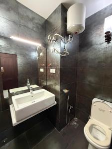a bathroom with a sink and a toilet at Eldorado Apartments F2P3 Wattala in Alwis Town +16 photos