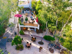 an overhead view of a courtyard with tables and chairs at Niik Tulum in Tulum