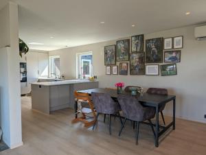 a kitchen and dining room with a table and chairs at Kongleveien 11C in Sandnes +10 photos