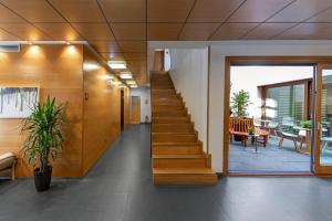 a hallway with a staircase in a building at Hotel Casa Azcona in Zizur Mayor