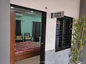 a view of a room with a bed and a mirror at Rail connect hotel statue of unity in Kevadia