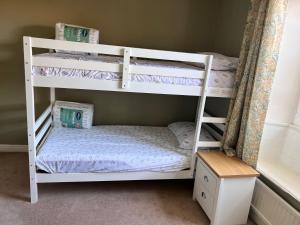 a couple of bunk beds in a room at Towler's Chemist in Kirkbymoorside