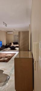 a living room with a couch and a table at Tara Home 204 in Sheikh Zayed