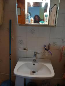 a bathroom with a sink and a mirror at ΑΝΝΑ'S Πύργος - ΣΑΜΟΣ in Pýrgos +40 photos