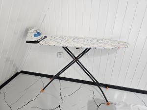 a small table in a room with a phone at Dreamvilla aframe in Gabala