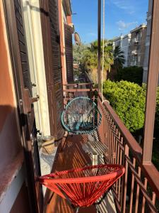 a balcony with two tables and a bench on a balcony at CASA Di ANNA 2 in Terracina
