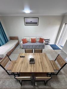 a living room with a couch and a table at Гостевой дом Бакай in Imeni Kirova