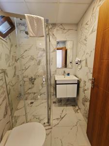 a bathroom with a shower and a sink at Grand Peninsula Hotel in Istanbul +64 photos