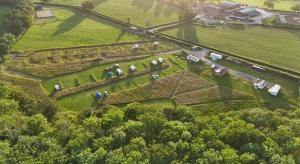 an aerial view of a garden with horses in it at Ready Pitched Tent stay Bring your own bedding in Trefnant