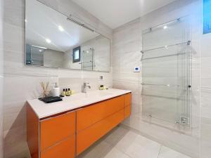 a bathroom with a sink and a shower at 7 Croisette in Cannes +63 photos