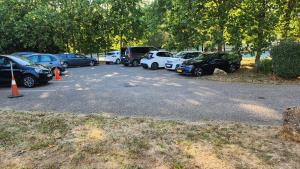 a bunch of cars parked in a parking lot at Campanile NATURE - Metz Technopôle in Metz +26 photos