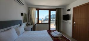 a hotel room with a bed with towels on it at Grand Peninsula Hotel in Istanbul