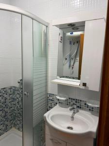 a bathroom with a sink and a mirror at Peaceful Home in Cabo Negro