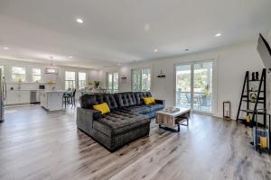 a living room with a couch and a kitchen at Nature's Touch in Edisto Island