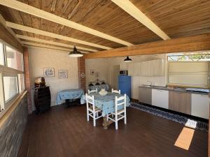 a kitchen with a table and chairs in a room at Casa Calipa in Marsala