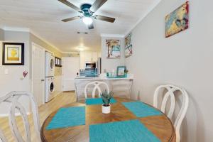 a kitchen and dining room with a table and chairs at Fiddlers Cove 6J in Hilton Head Island