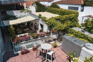 an aerial view of a patio with a table and chairs at Pensao O Laranjeira in Viana do Castelo
