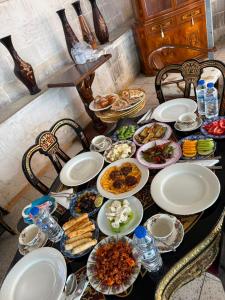 a table with plates of food on it at antik senyora butik in Urfa