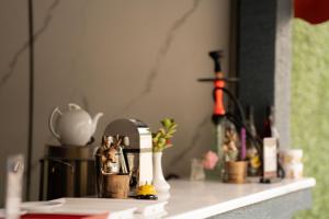 a counter top with plants and other items on it at Forelle Restaurant & Motel in Çuxuryurd +100 photos