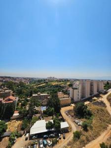 an aerial view of a city with buildings at Appartement Birkhadem in Birkhadem