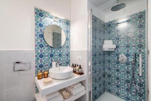 a bathroom with a sink and a shower at Villa Belvedere Amodeo - terrace, seaview, wifi in Conca dei Marini +31 photos