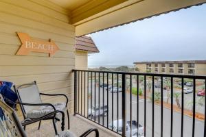 a balcony with a bench and a parking lot at HH Beach & Tennis 344B in Hilton Head Island