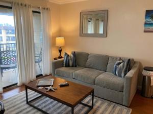 a living room with a couch and a coffee table at HH Beach & Tennis 344B in Hilton Head Island