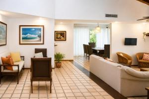 a living room with a couch and a table at The White Villa in Cancún