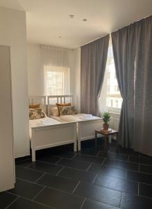 a bedroom with a bed and a window at Hannover Central Apartment in Hannover