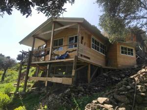 a large wooden house on a hill at Shepherds Cabin in Kadita - בקתת רועה בקדיתא in Kadita