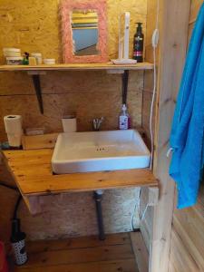 a bathroom with a sink on a wooden table at Shepherds Cabin in Kadita - בקתת רועה בקדיתא in Kadita +13 photos