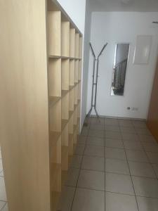 a hallway with a room with shelves and a mirror at Boardinghouse Casita Amann in Friedrichshafen +66 photos