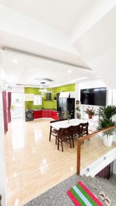 a dining room and living room with a table at David Home in Danang