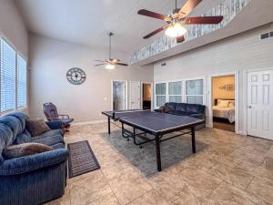 a living room with a ping pong table in it at The Beach House I in Garden City