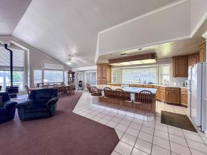 a large kitchen and living room with a refrigerator at The Beach House I in Garden City
