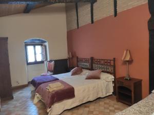 a bedroom with a bed and a window at Etxezarra in Sáseta