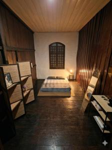 a bedroom with a bed in the middle of a room at Thai Traditional Home in Bangkok +1 photo