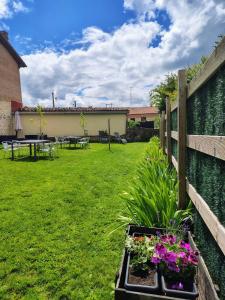 a garden with a fence and some flowers at Etxezarra in Sáseta