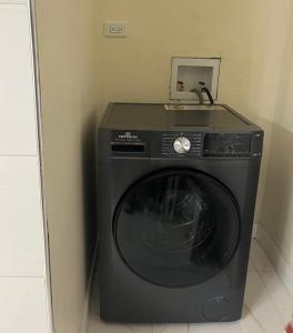 a washing machine with a sink on top of it at Haven Garden Retreat in Kingston +21 photos